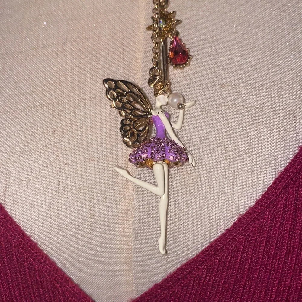 Betsey Johnson ballerina with butterfly wings and crown holding it necklace
